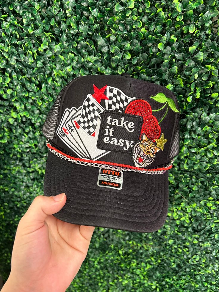 Get ready to take on the day with our Take It Easy Trucker Hat! Custom made at our in-store hat bar, this hat is perfect for adding a fun and playful touch to any outfit. Trendy Hats For Kentucky Derby, One Size Fits Most, Casual Snapback Party Hat, Trendy Party Hats One Size Fits Most, Trendy Party Hat, One Size Fits Most, Trendy Trucker Hat For Party With Short Brim, Trendy Snapback Party Hats, Novelty Mini Snapback Hat, Adjustable Novelty Hats One Size, Trendy Hats For Kentucky Derby Party