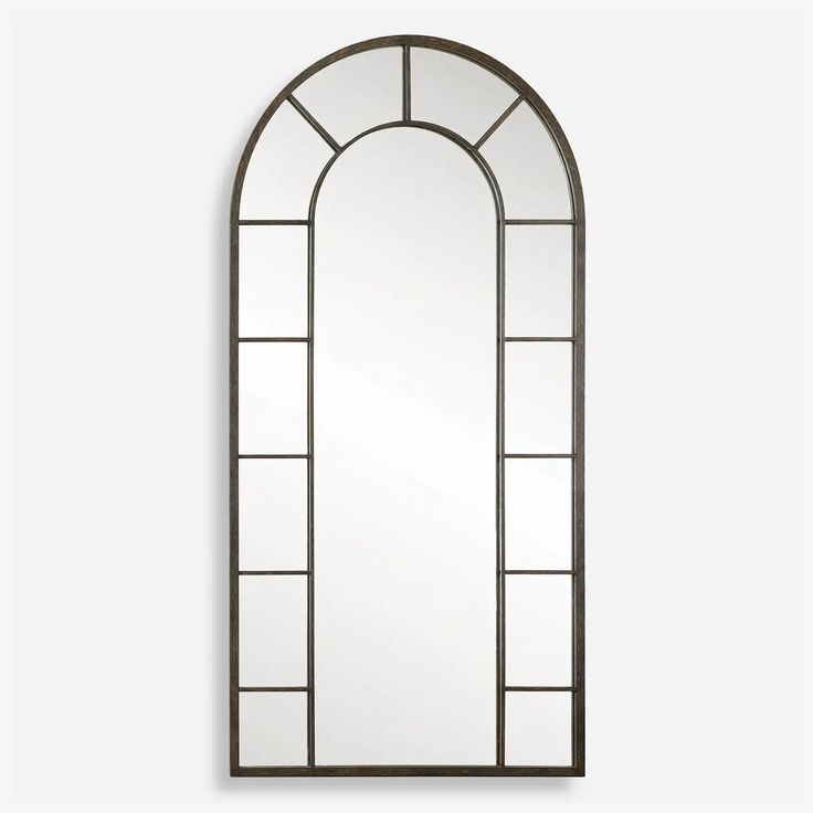 an arched mirror with glass panels on the front and back sides, against a white wall