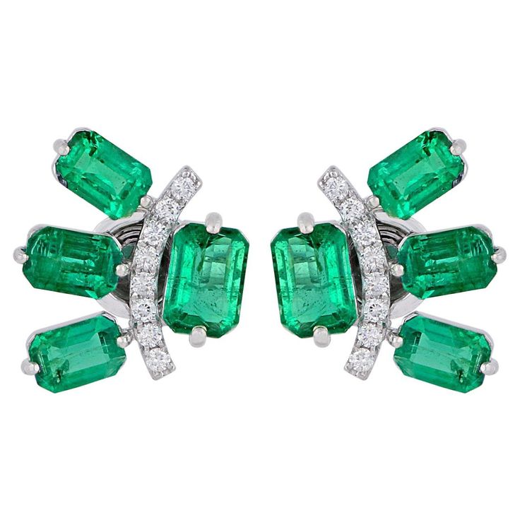 Cast in 14 karat gold, these stud earrings are hand set with 5.10 carats emerald and .22 carats of glimmering diamonds. FOLLOW MEGHNA JEWELS storefront to view the latest collection & exclusive pieces. Meghna Jewels is proudly rated as a Top Seller on 1stDibs with 5 star customer reviews. All items manufactured by us are handmade and can be customized or redesigned. Composition Gross Weight :- 5.15 gm 14k White Gold Weight :- 4.09 gm Diamond Weight :- 0.22 ct. (Si Clarity Hi Color ) Emerald Weig Green Fine Jewelry Cluster Earrings For Formal Events, Baguette Earrings, Emerald Stud Earrings, Baguette Earring, Emerald Diamond Earrings, Diamond Earrings Design, Emerald Earrings Studs, Gold Earrings For Women, 18k Gold Earrings