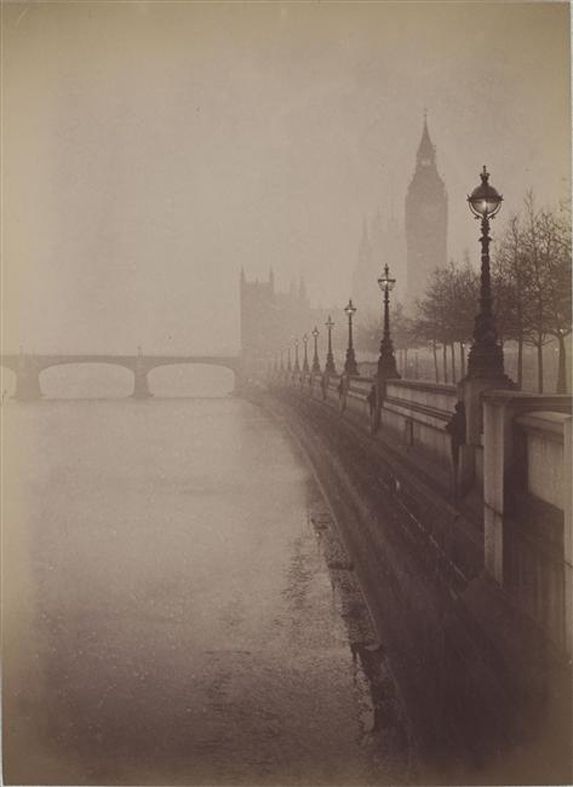 the big ben clock tower towering over the city of london on a foggy day