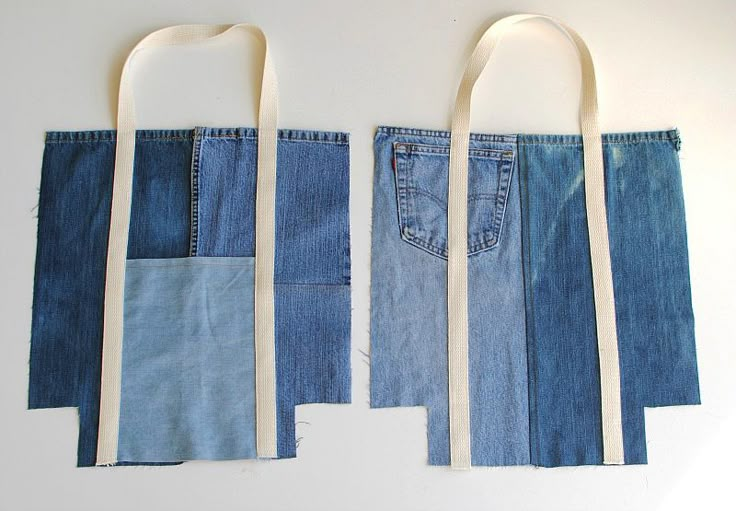 two bags made out of old jeans are hanging on the wall