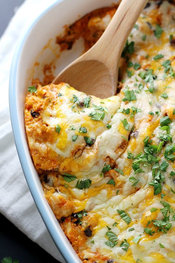 a casserole dish with cheese and herbs in it, ready to be eaten