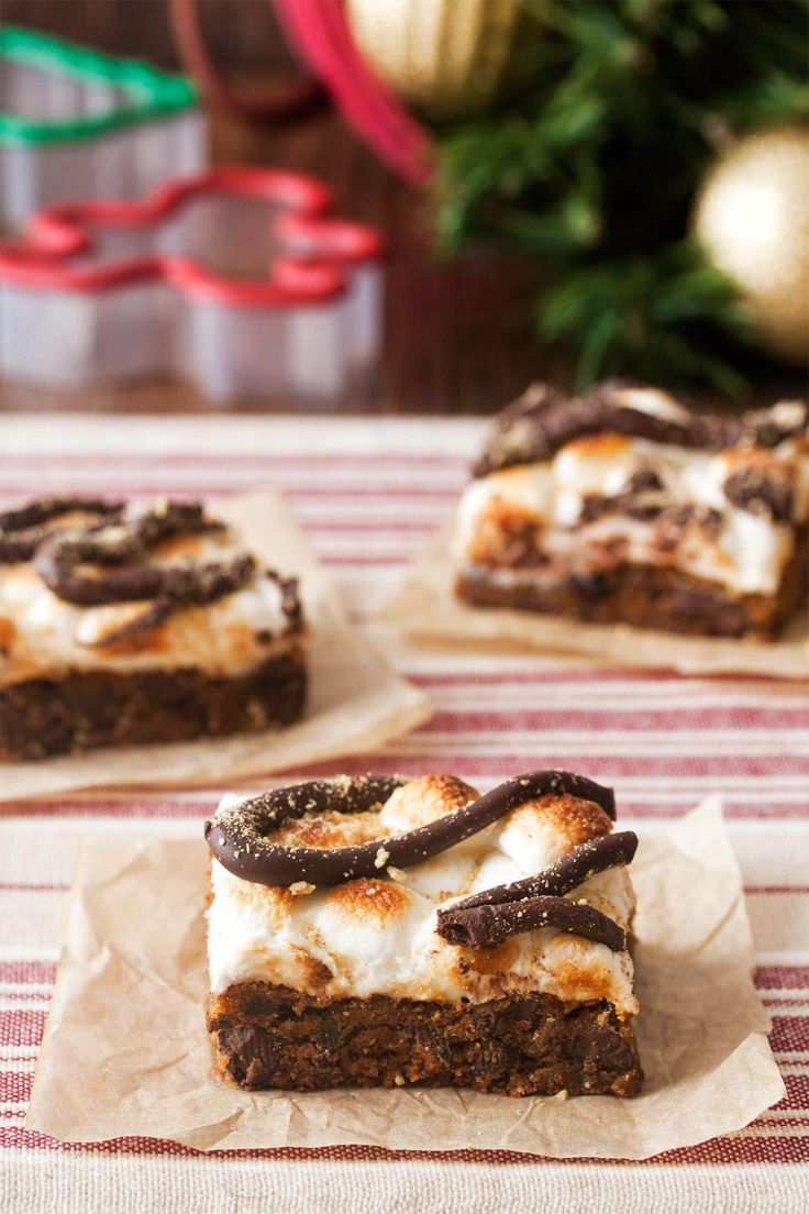 three pieces of dessert sitting on top of a table next to a christmas ornament