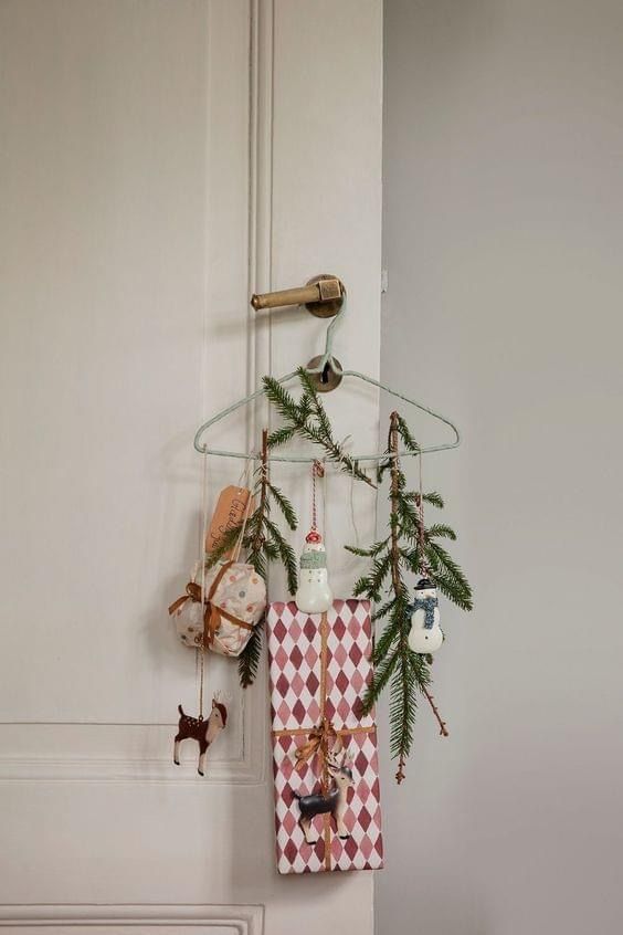 a towel hanging on the wall next to a door with christmas decorations and other items