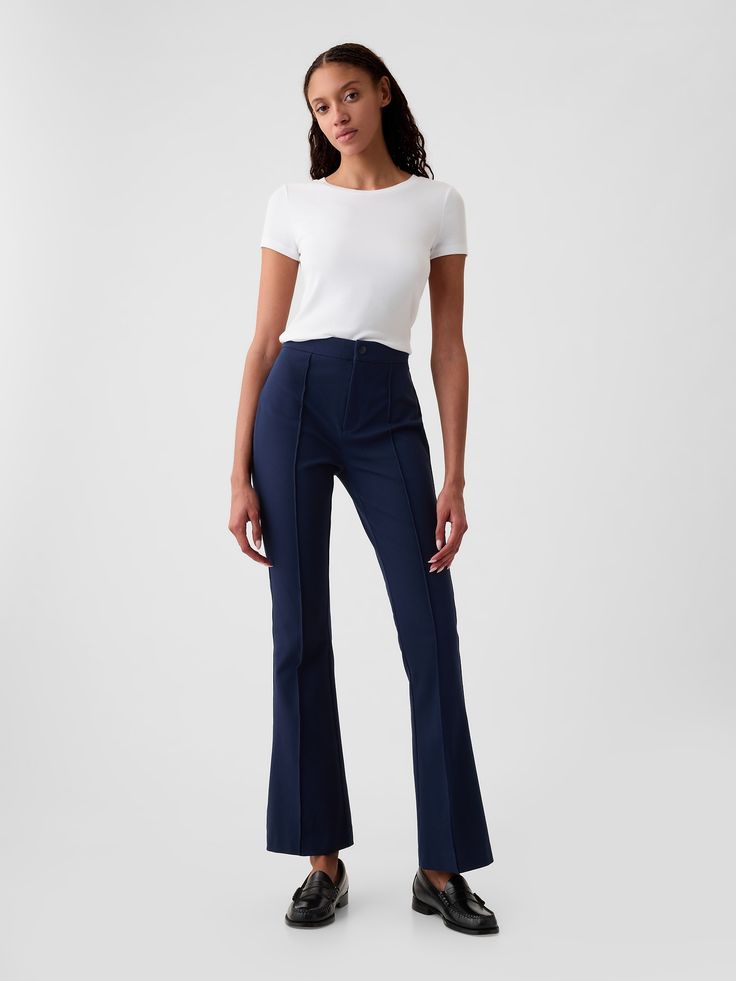 Soft cotton-spandex stretchy dress pants.  Snap button closure, zip fly.  Pintuck pleat at front.  Back welt pockets.  Our High Rise Jean has an 11" 28 cm) rise. ​ Slim through the hip and thigh, flares from knee to leg opening.  Model is approx.  5’10” wearing Best Work Pants, Stretchy Dress Pants, Buisness Casual, Work Pants Women, Navy Blue Pants, Business Pants, Blue Trousers, Stretchy Pants, Stretchy Dress