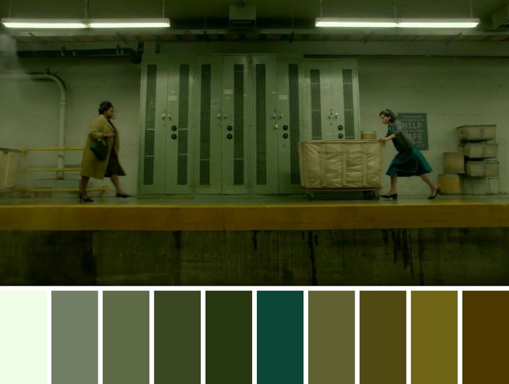 two people walking on a subway platform with color swatches