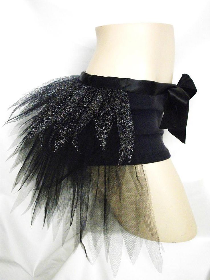 a mannequin with black tulle and bow on it's headband