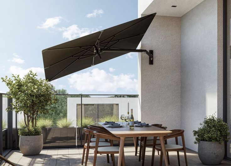 an outdoor table and chairs with an umbrella over it