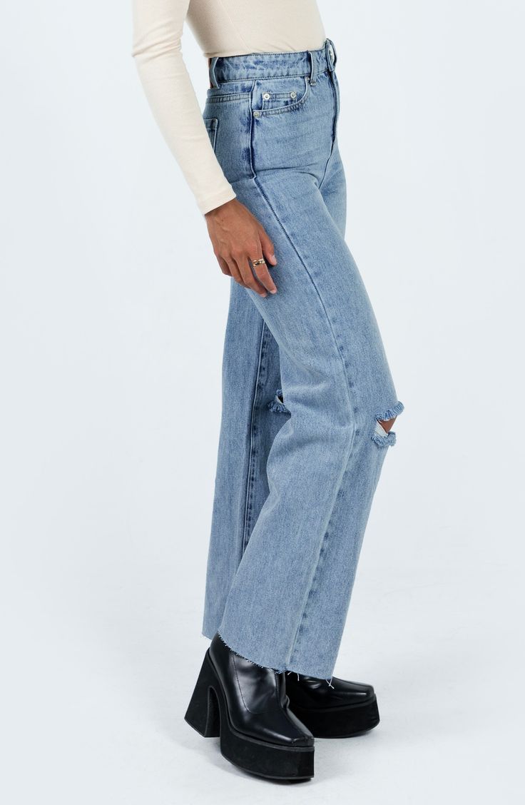 Made partially with organic cotton, these classic-fit straight-leg jeans feature ripped knees and raw hems for casual-cool, vintage-inspired style. 29 1/2" inseam; 20" leg opening; 13" front rise; 15 1/2" back rise (size 8) Zip fly with button closure Five-pocket style 50% organic cotton, 50% recycled cotton Machine wash, line dry Imported Casual Ripped Cropped Jeans In Rigid Denim, Medium Wash Ripped Flare Jeans In Rigid Denim, Ripped Flare Jeans In Medium Wash Denim, Fall Ripped Cropped Jeans In Rigid Denim, Ripped Rigid Denim Cropped Jeans For Fall, Ripped Rigid Denim Bottoms For Everyday, Everyday Ripped Wide Leg Jeans, Everyday Ripped Wide-leg Jeans, Ripped Wide Leg Jeans For Everyday Wear