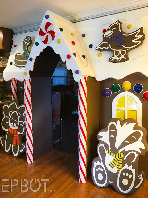 the gingerbread house has been decorated with candy canes and other decorations for christmas