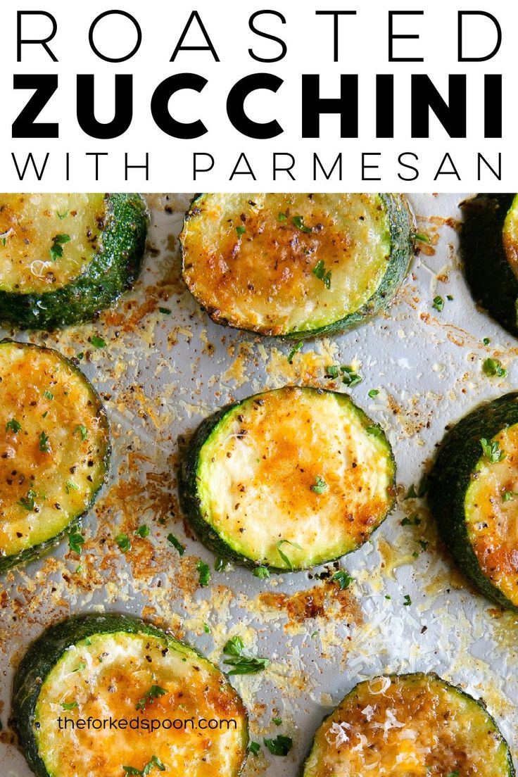 roasted zucchini with parmesan cheese on a sheet of baking paper and text overlay that reads roasted zucchini with parmesan cheese