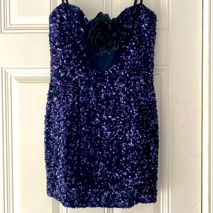 Worn Once, Like Brand New. Been In A Protective Garment Bag Since Use. Purchased For $375 Shimmery Sequins Lend Bold Energy To This Showstopping Minidress With A Bold Rosette Above A Breezy Front Cutout. 24" Center Front Length (Size Medium) Back Zip Closure Sweetheart Neck Adjustable Straps Stretch Lining 95% Polyester, 5% Spandex Hand Wash, Dry Flat Made In The Usa Of Imported Fabric Hispanic & Latinx Owned/Founded Item # 10091946 Glamorous Purple Mini Dress For Formal Occasions, Purple Sequined Mini Dress For Formal Occasions, Glamorous Purple Mini Dress For Evening, Glamorous Purple Evening Mini Dress, Elegant Purple Mini Dress For Party, Purple Sequined Mini Dress For Evening, Glamorous Purple Mini Dress For Cocktail, Embellished Purple Mini Dress For Evening, Elegant Embellished Purple Mini Dress