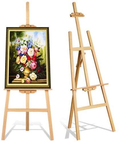 an easel with a painting on it next to another easel that has flowers in it