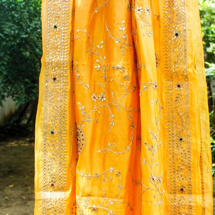 Presented to you all from an exclusively designed standard set of collection. These exquisite Handloom Silk Dupattas are made by the best and come with a unique design along with classic touch to it. Kora/Organiza Dupattas will be the talk of every gathering you attend, and heads will hardly stop turning your ways. Fabric: Pure kora silk/organza Craft- Patti jaal Length – 2.75 meters. Note- There may be slight color variations due to photographic reasons. This is a hand-woven product and any irr Yellow Silk Salwar Kameez With Intricate Embroidery, Elegant Tussar Silk Dupatta With Dori Work, Elegant Silk Thread Dupatta With Dori Work, Elegant Tussar Silk Traditional Wear With Dori Work, Elegant Traditional Wear With Handwork In Raw Silk, Elegant Chanderi Anarkali Set With Handwork, Elegant Yellow Embroidered Sharara, Elegant Tussar Silk Embroidered Fabric, Elegant Tussar Silk Embroidered Fabric For Festivals