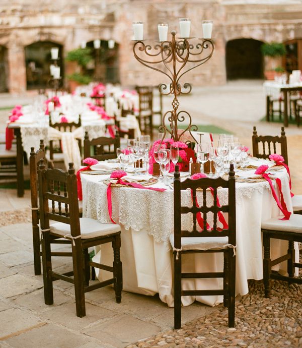 the tables are decorated with pink flowers and napkins