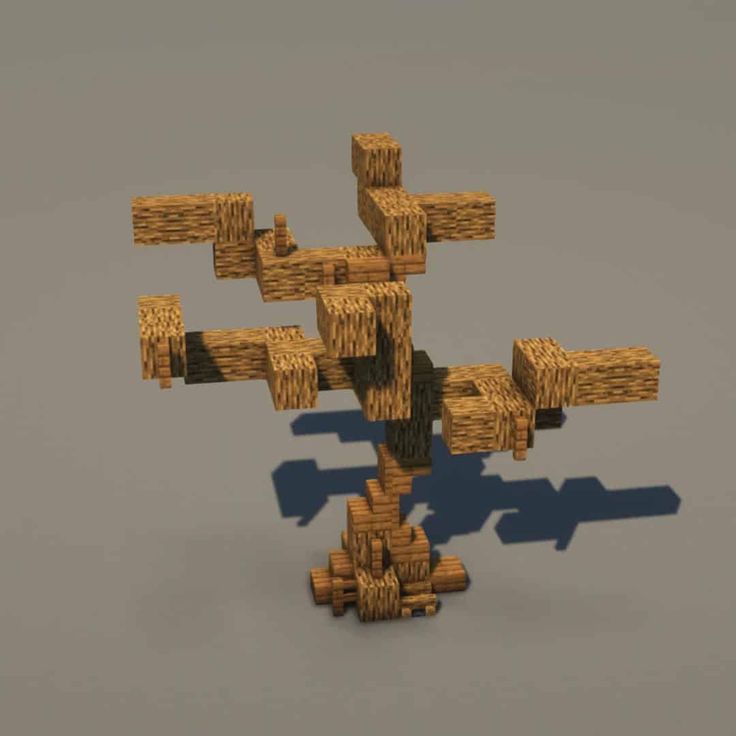 a bunch of wood pieces are arranged in the shape of a cross on a gray background