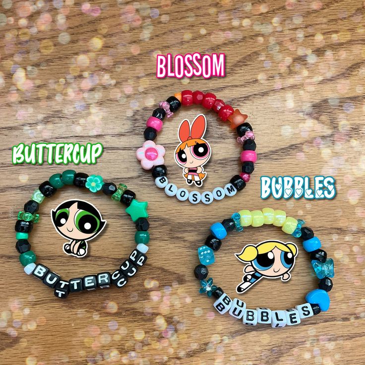 ✨Are you a fan of the Powerpuff girls?✨ Then look no further because these bracelets are perfect for you! Each bracelet is stretchy enough to fit an average sized wrist. However, if a bigger or smaller size is needed please let me know when placing your order!  ❗️DISCLAIMER: I own nothing but the patterns/designs of these bracelets. All other rights go to their respective owners. It is recommended you don't get these bracelets wet. Positive Bracelet Words, 3 Matching Bracelets, Kandi Bracelets Ideas Pony Beads, Trendy Black Plastic Bracelets, Character Kandi Bracelets, Customized Black Trendy Stretch Bracelet, Powerpuff Girls Bracelet, Character Bracelet Ideas, Matching Bead Bracelets