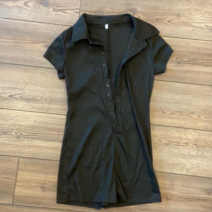 Black Button Down Romper Size Medium. Purchased From Shein. Never Worn. Can Be A Bathingsuit Cover Up, Romper With Bralette/Crop Top Under Fitted Short Sleeve Jumpsuit With Buttons, Black Button-up Jumpsuits And Rompers For Summer, Fitted Collared Jumpsuit With Button Closure, Fitted Collared Jumpsuits And Rompers With Buttons, Black Button-up Jumpsuit For Work, Black Button-up Jumpsuits And Rompers, Black Summer Jumpsuit With Button Closure, Black Fitted Button-up Jumpsuits And Rompers, Bralette Crop Top