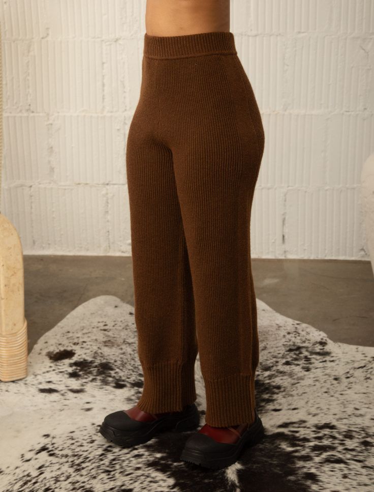 SPORTY STRAIGHT LEG PANT WITH STITCH BLOCKING AT VERTICAL SIDE SEAM 6%WOOL 20%ACRYLIC 20%NYLON 54%POLYESTER Priya is 5'6" wearing a size S/M STYLE# G1141 Available sizes: S/M, M/L Winter Full-length Pants With Ribbed Waistband, Full Length Wool Bottoms For Fall, Brown Wide Leg Sweatpants For Winter, Wide Leg Brown Sweatpants For Winter, Winter Full-length Bottoms With Ribbed Waistband, Winter Wide Leg Pants With Ribbed Waistband, Winter Workwear Bottoms With Ribbed Waistband, Brown Straight Pants For Winter, Brown Wool Pants For Winter