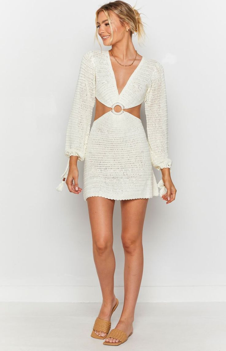 White Crochet DressRock this dress poolside at your next resort stay and sip on cocktails all afternoon! Complete the look with gold accessoriesLong sleeve with adjustable cuff tassel tiesCutouts in all the right placesCircular wooden-like feature at the centreV-necklineOpen-back designMini lengthAdjustable tassel waist ties at the backUnlinedMid-weight crochet material with stretch*We recommend not hanging your crochet products to avoid any fabric stretch Beach Mini Dress, Outfit Invierno, Estilo Boho Chic, Mini Dress Casual, White Crochet, Beach Dresses, Mini Dress Party, Dress White, Striped Long Sleeve