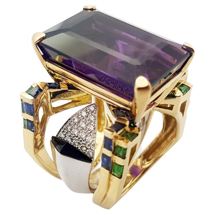 Amethyst 28.79 carats, Tsavorite 1.82 carats, Blue Sapphire 0.27 carat and Diamond 0.27 carat Ring set in 18 Karat Gold Settings Width: 1.7 cm Length: 2.2 cm Ring Size: 53 Total Weight: 31.09 grams "We first opened doors in 1980 when it was then situated in the vicinity of the Victory Monument; a small and modest storefront with a couple of counters. From its humble beginnings to where it stands today, our company has proven its abilities as a jeweler. Since the beginning, we have been supplying Blue Sapphire Diamond Ring, Blue Sapphire Diamond, Fashion Watch, Diamond Ring Settings, Gold Ring Sets, Gold Diamond Rings, High Jewelry, Artisan Jewelry, Ring Set