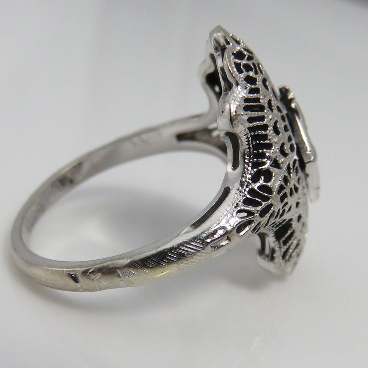 Art deco 14k white gold. estate 1920's diamond ring. size 6.75. quality clean 5pt diamond . great shape. mark 14k. 2.9grams. 2omm long. Art Deco White Gold Rings Stamped 14k, Victorian Platinum Diamond Ring With Hallmark, Victorian Platinum Diamond Ring Hallmarked, White Gold Art Deco Rings Stamped 14k, Antique Engraved White Gold Filigree Ring, Art Deco Engraved Filigree Ring For Formal Occasions, Victorian Engraved Filigree Ring For Formal Occasions, Antique Engraved Filigree Ring For Formal Occasions, Antique Filigree Engraved Ring For Formal Occasions