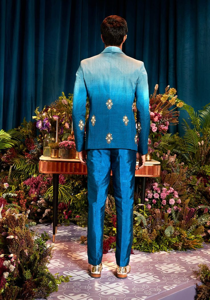 Featuring an ombré blue blazer with placement motifs comprising of metal embellishments, glass beads and pearls, paired with an ice blue shirt and dark blue plain pants Comeback Photoshoot, Dark Blue Plain, Papa Don't Preach, Dark Blue Pants, Artistic Fashion, Metal Embellishments, Shirt Jacket Men, Plain Pants, Party Kleidung