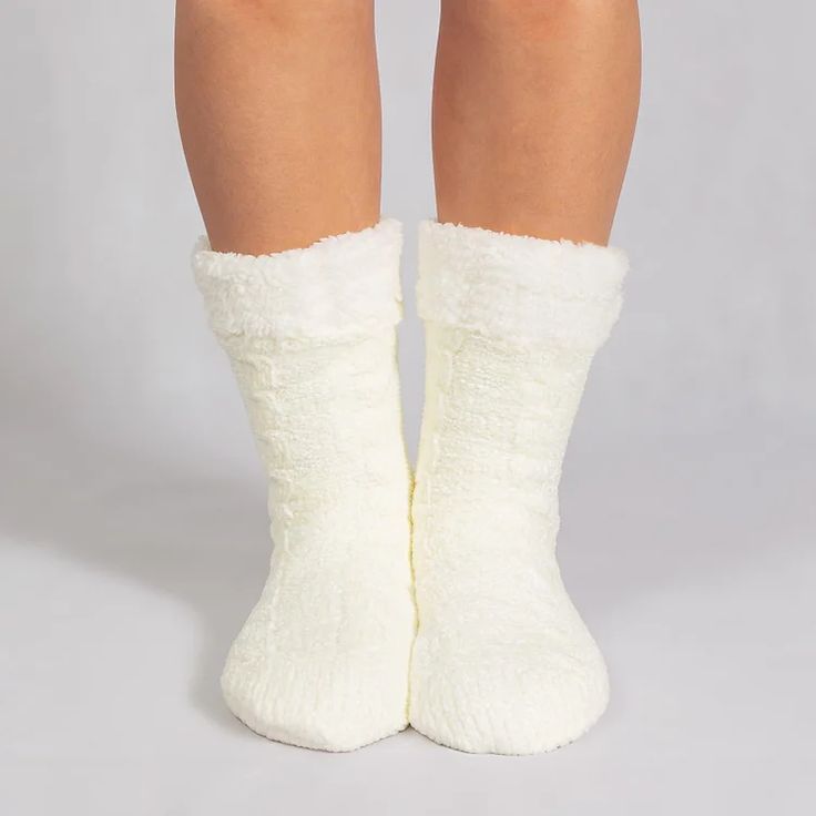 The is a super soft ONE SIZE FITS MOST pair of slipper socks that keep your feet cozy and comfortable. With a thick flannel fleece outer lining and premium sherpa fleece on the inside, theyll keep your feet toasty warm, even on the coldest floors. 100% cruelty-free. Get yours today! Package：A pair of socks Soft Indoor Socks For Winter, White Winter Home Slippers, Cozy Thick White Socks, White Cozy Slippers For Home, Cozy Warm Socks For Indoor, Cozy White Slippers For Home, Cozy Super Soft Indoor Socks, Warm Cozy Socks For Indoor Use, Cozy Warm Socks For Indoor Use