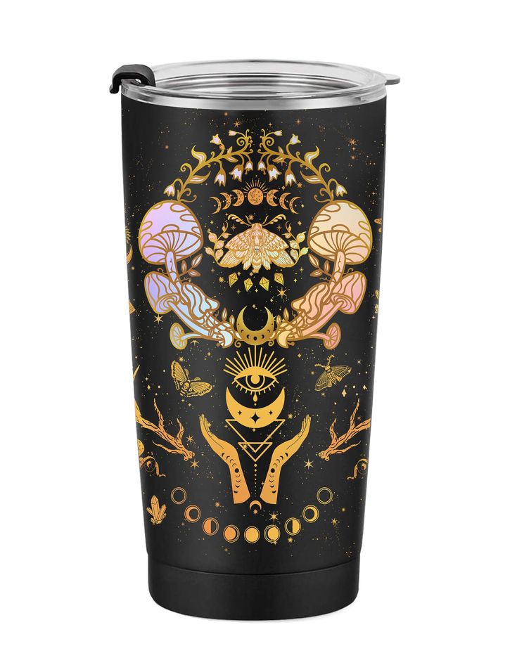 a black tumbler cup with gold and pink designs on the side, featuring mushrooms