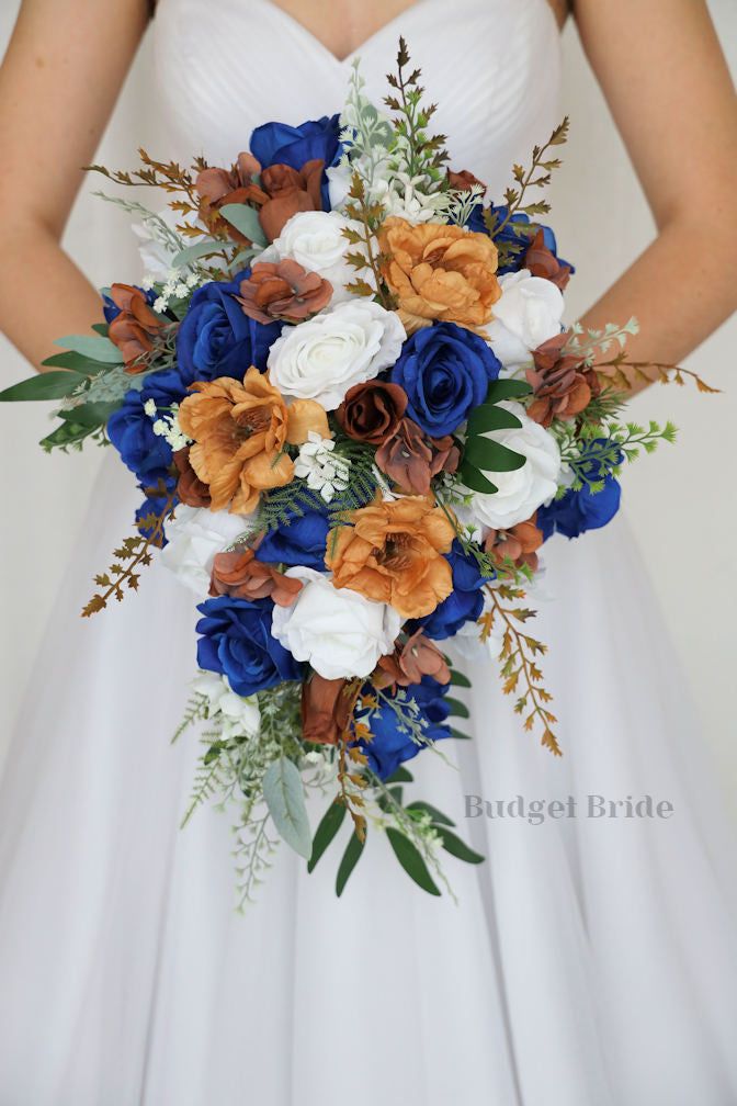 a bridal holding a blue and white bouquet