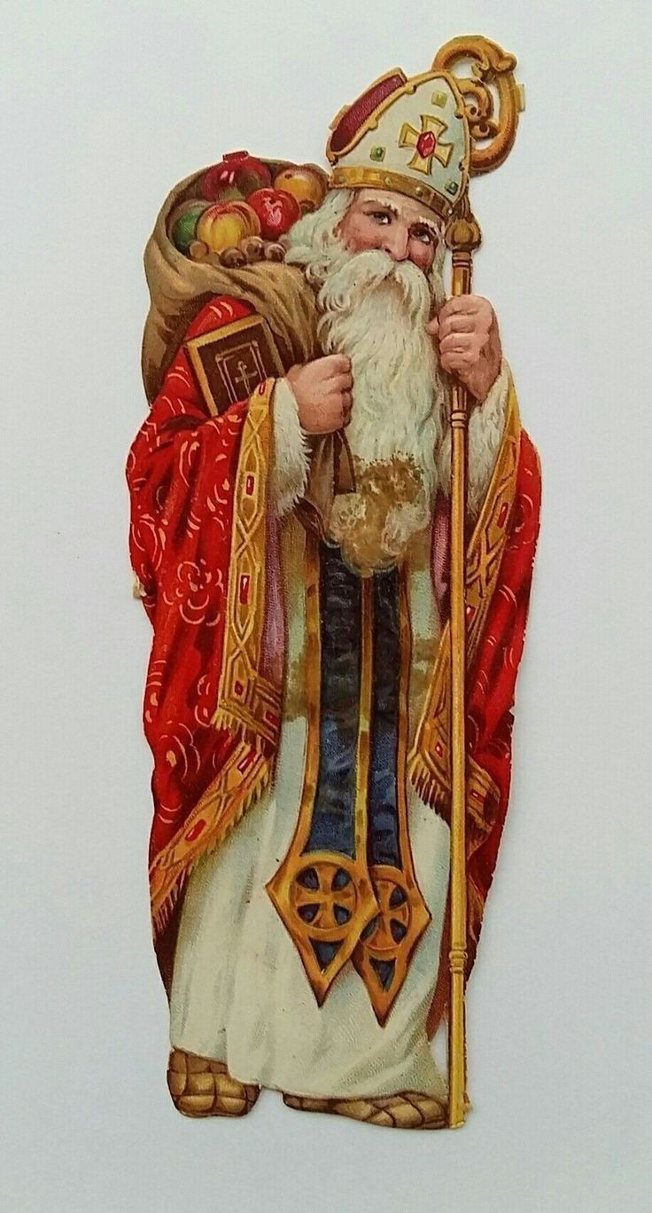 a statue of santa claus holding a staff