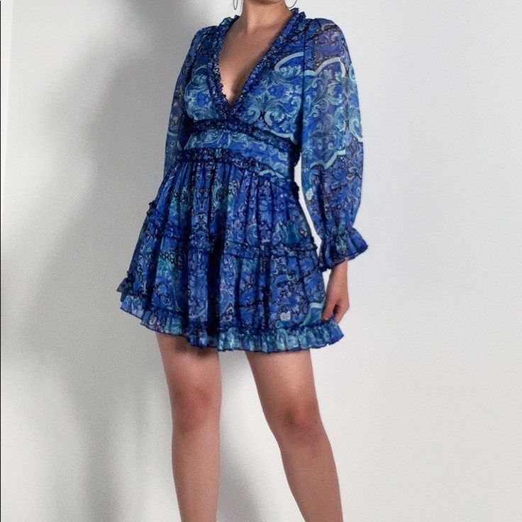 Paisley Type Print Frock Features A Floaty Chiffon Fabrication, Deep V Neckline, Bell Sleeves With Puffed Shoulders, Ruffle Trim, And A Plunging Open Back With Button Loop Closures At The Neck. Tags Still Attached Can’t Fit It 100% Polyester 32.5” Shoulder To Hem, 22” Sleeves Blue Chiffon Mini Dress For Vacation, Blue Chiffon Dress For Day Out, Fitted Blue Chiffon Mini Dress, Blue Floral Print Chiffon Mini Dress, Blue Floral Chiffon Mini Dress, Blue Chiffon Mini Dress With Long Sleeves, Blue Chiffon Long Sleeve Mini Dress, Blue Long Sleeve Chiffon Mini Dress, Blue Long Sleeve Mini Dress With Ruffle Hem