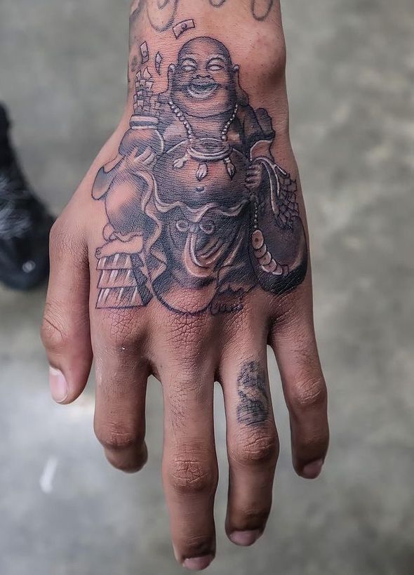 a person with a tattoo on their hand