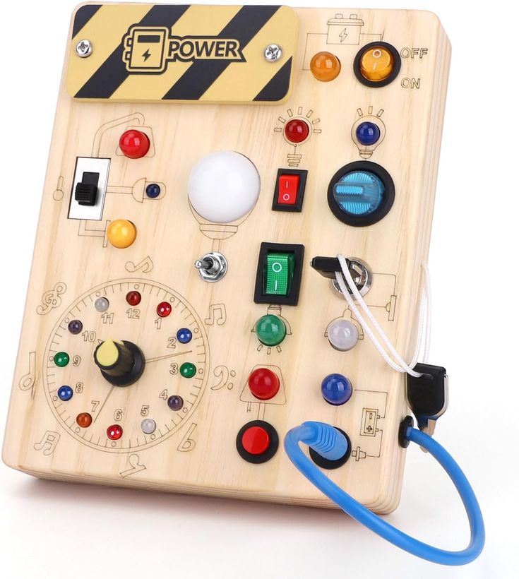 a wooden board with various buttons and knobs on it's sides, attached to a blue cord