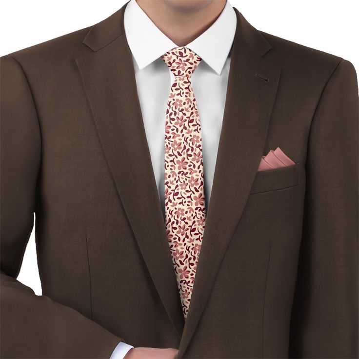 An arrangement of scattered blossoms, leaves, and petals gives a timeless quality to these floral wedding ties. The elegant design gives a nod to the past, while the modern monochromatic palette roots it firmly in the present. Each of these floral ties is proudly made to order in Denver, using sustainable materials and processes that help to preserve the world for the generations to come. The colors can easily be customized to match any dress, making them a great fit for groomsmen. As shown, the Floral Ties, Floral Necktie, Monochromatic Palette, Navy Suit, Wedding Ties, Neck Gaiters, Small Bows, Kids Pillows, Eco Friendly Fabric