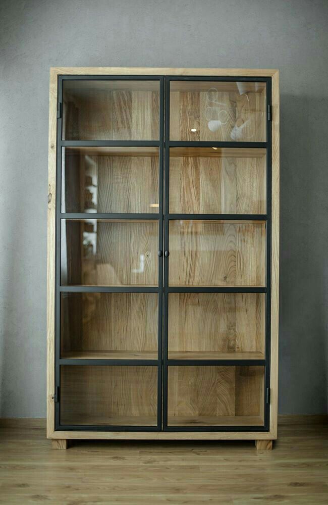 an empty wooden cabinet with glass doors on the front and bottom shelves, against a gray wall