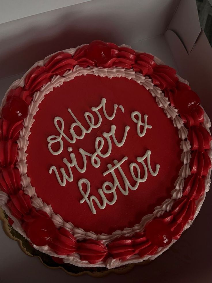 a red and white cake with writing on it