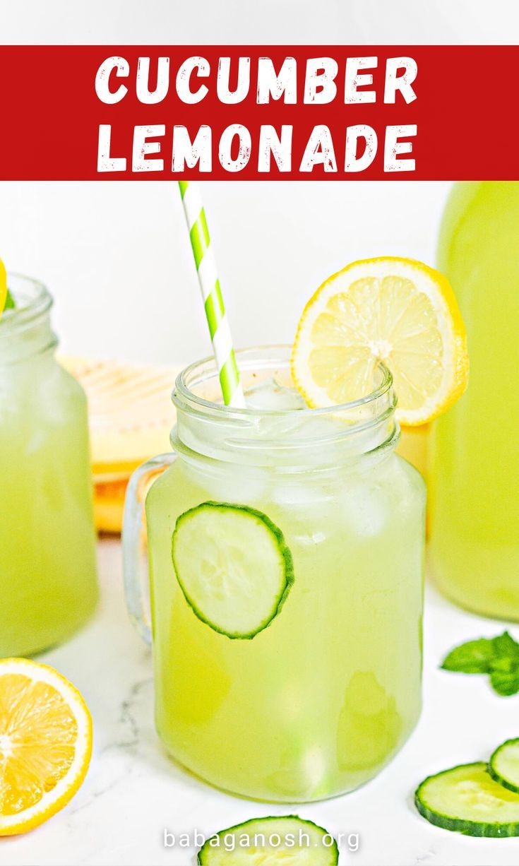 two mason jars filled with lemonade and cucumber slices, one has a green striped straw