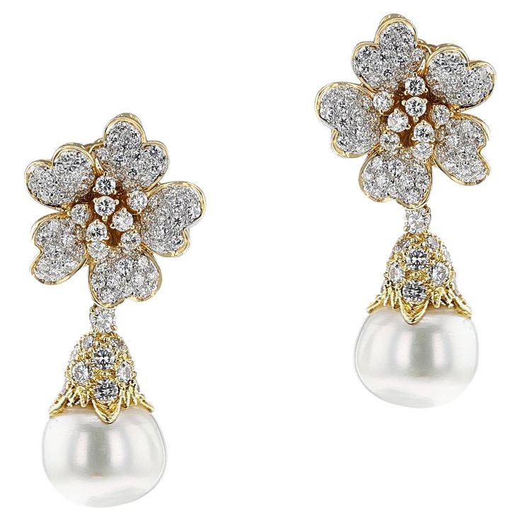 A pair of Pearl and Diamond Day and Night Earrings made in 18k Yellow Gold. The Diamonds are G color, VS clarity, appx. 4.50 carats. The total weight of the earring is 23.17 grams and the length is 1.75." The size of the pearls are 13.8MM. The night earrings is with the dangling pearl, and the day earrings are without the pearl, which can be detached easily. SKU: 1485 Luxury Pear-shaped Diamond Earrings For Evening, Luxury White Clip-on Diamond Earrings, Luxury Pear-shaped Brilliant Cut Earrings, Luxury Pear-shaped Earrings For Evening, High Luster Diamond Earrings For Formal Occasions, Fine Jewelry Earrings With High Luster For Evening, Exquisite High Luster Earrings For Anniversary, Luxury High Luster Earrings For Anniversary, Exquisite High Luster Earrings For Formal Occasions