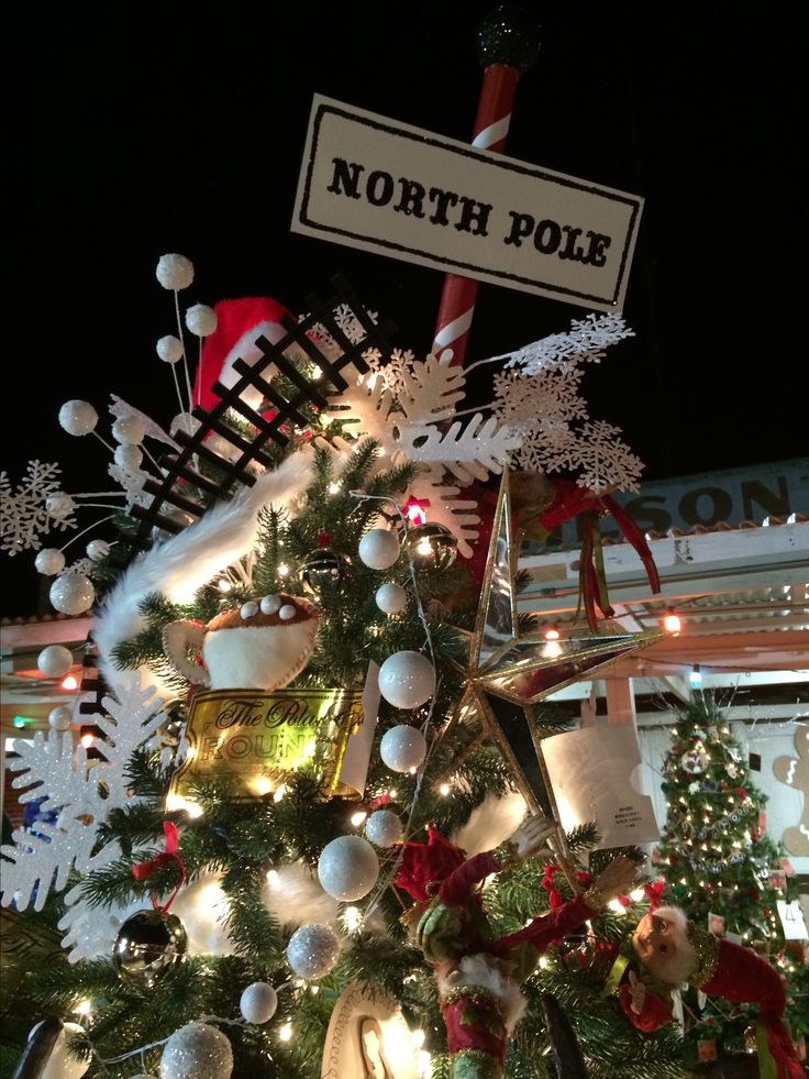 a christmas tree is decorated with ornaments and lights