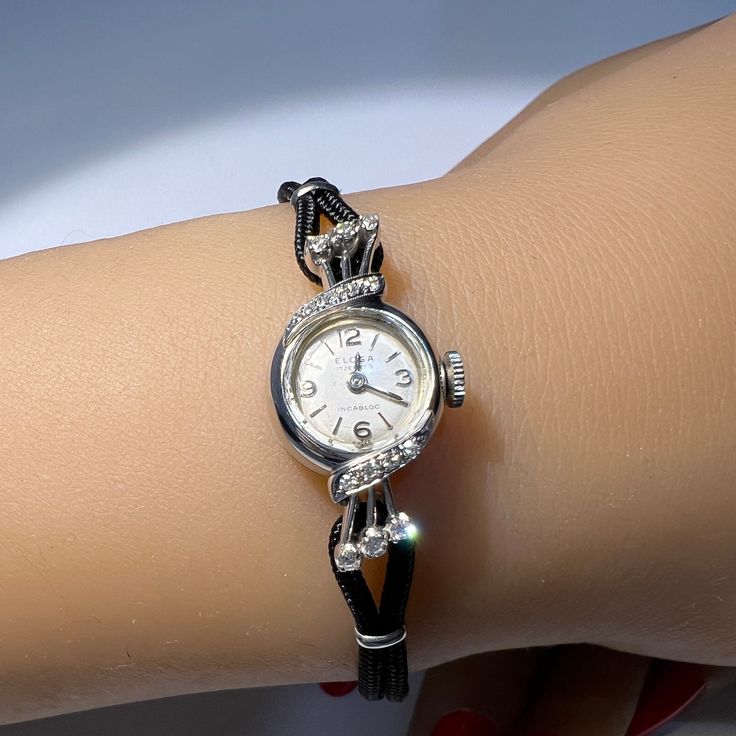 A free gift of a trendy silk bracelet is included with your purchase. At this time we are offering a free $400 restoration which includes cleaning and polishing. This is done prior to shipment so please allow 7 to 10 days for this work. Length: 7 1/2 inches. Can be sized down. Mechanical movement Elegant Evening Diamond Watch With Bracelet Strap, Elegant Evening Diamond Watch With 17 Jewels, Evening Diamond Jewelry With Bracelet Strap, Evening Watches With Jubilee Bracelet, Evening Round Watch With Jubilee Bracelet, Diamond Bracelet Strap Jewelry And Watches For Formal Occasions, Formal Diamond Bracelet Strap Jewelry And Watches, Elegant Diamond Watch With Bracelet Strap, Elegant Bracelet Strap Jewelry And Watches For Anniversary