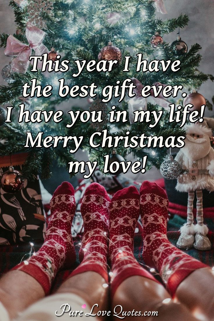 someone's feet in front of a christmas tree with the words, this year i have