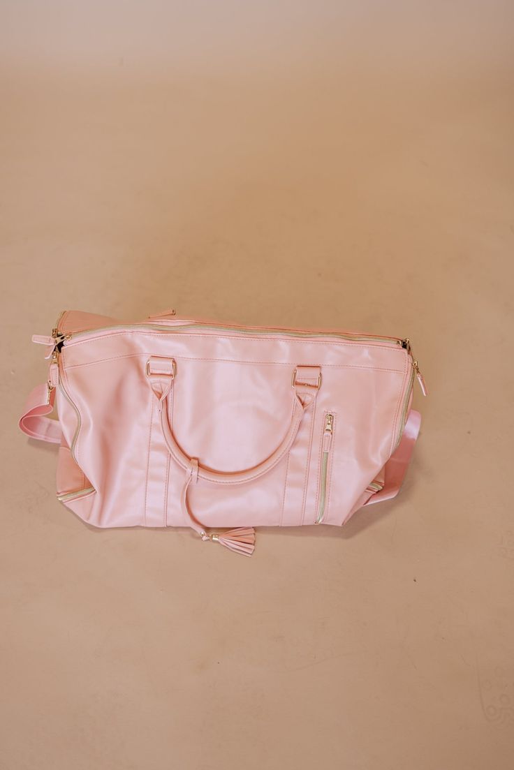 Introducing the Lilly Temple Bag - the ultimate accessory for your temple visits. With its spacious design, pink hue, and shoulder strap, it effortlessly fits multiple outfits and shoes. The built-in hanger port allows for easy organization, while the numerous pockets keep your essentials within reach. Pink Rectangular Diaper Bag With Zipper, Pink Rectangular Diaper Bag With Zipper Closure, Pink Satchel Weekender Bag For Travel, Pink Tote Weekender Bag With Zipper, Pink Duffle Bag Satchel For Travel, Pink Tote Weekender Bag With Zipper Closure, Large Capacity Pink Satchel For Travel, Pink Functional Travel Diaper Bag, Pink Bags With Large Capacity For Trips