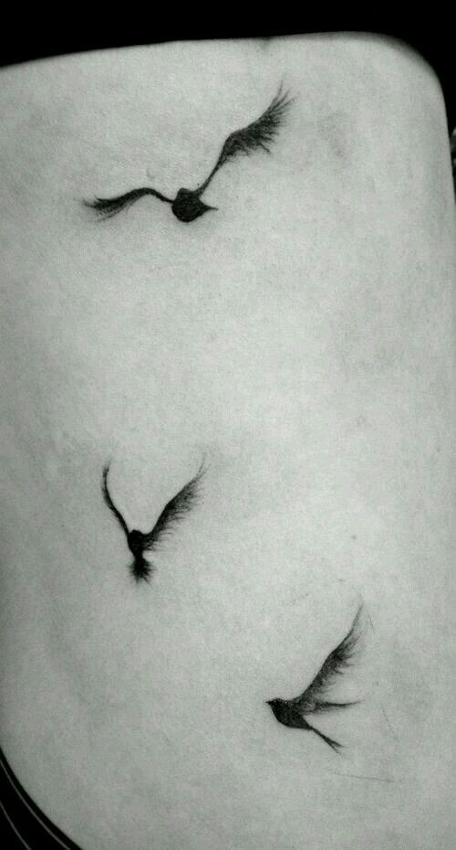 an image of two birds on the side of a woman's stomach with caption