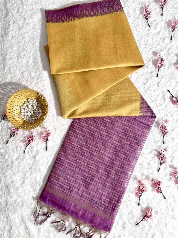 Fabric Details : Indulge in luxury with our Gold Yellow Premium Tussar Silk Saree. Made from high quality and rare Tussar silk, this saree offers a luxurious drape and a soft feel against the skin. Elevate your style with the natural shine and unique texture of this premium fabric. Saree Color : Gold Yellow Saree Work : Thread Woven Saree Length : 5.5 Meter Blouse Length : 0.8 Meter Wash : Dry Clean Product color may little differ as per the brightness or color settings of your device. Fusion Style Silk Pre-draped Saree With Traditional Drape, Fusion Style Silk Pre-draped Saree With Cutdana, Fusion Style Silk Pre-draped Saree, Silk Fusion Blouse Piece With Traditional Drape, Festive Fusion Silk Pre-draped Saree, Fusion Style Silk Saree With Dupatta, Fusion Silk Pre-draped Saree With Dupatta, Fusion Silk Pre-draped Saree For Festivals, Festive Fusion Silk Blouse Piece