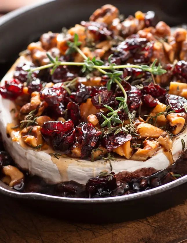 a pan filled with food sitting on top of a wooden table