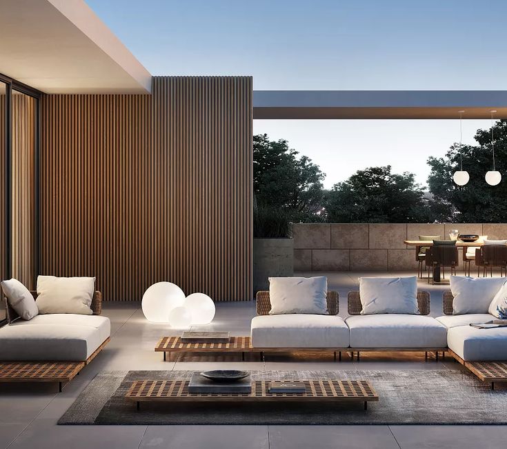 a living room filled with lots of white furniture