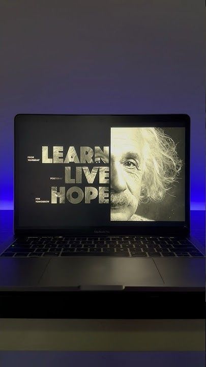 an open laptop computer sitting on top of a table with the words learn live hope