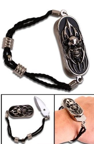 an image of a bracelet with a skull on it and a knife in the middle