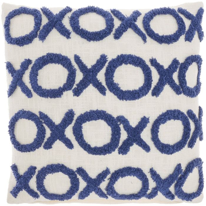 a blue and white decorative pillow with circles on it's side, in the shape of xoxo